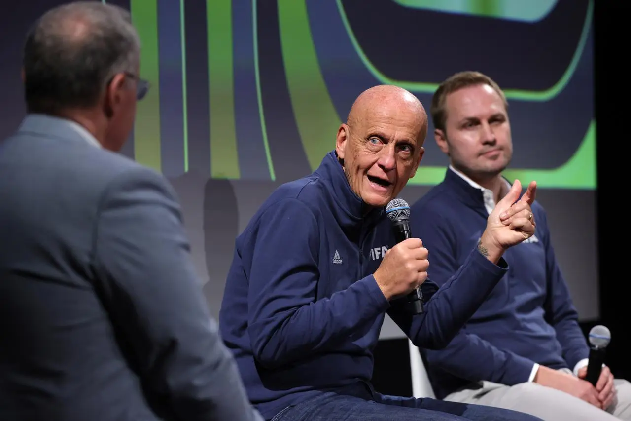 Pierluigi Collina, centre, at a panel discussion ahead of the 2026 FIFA World Cup draw