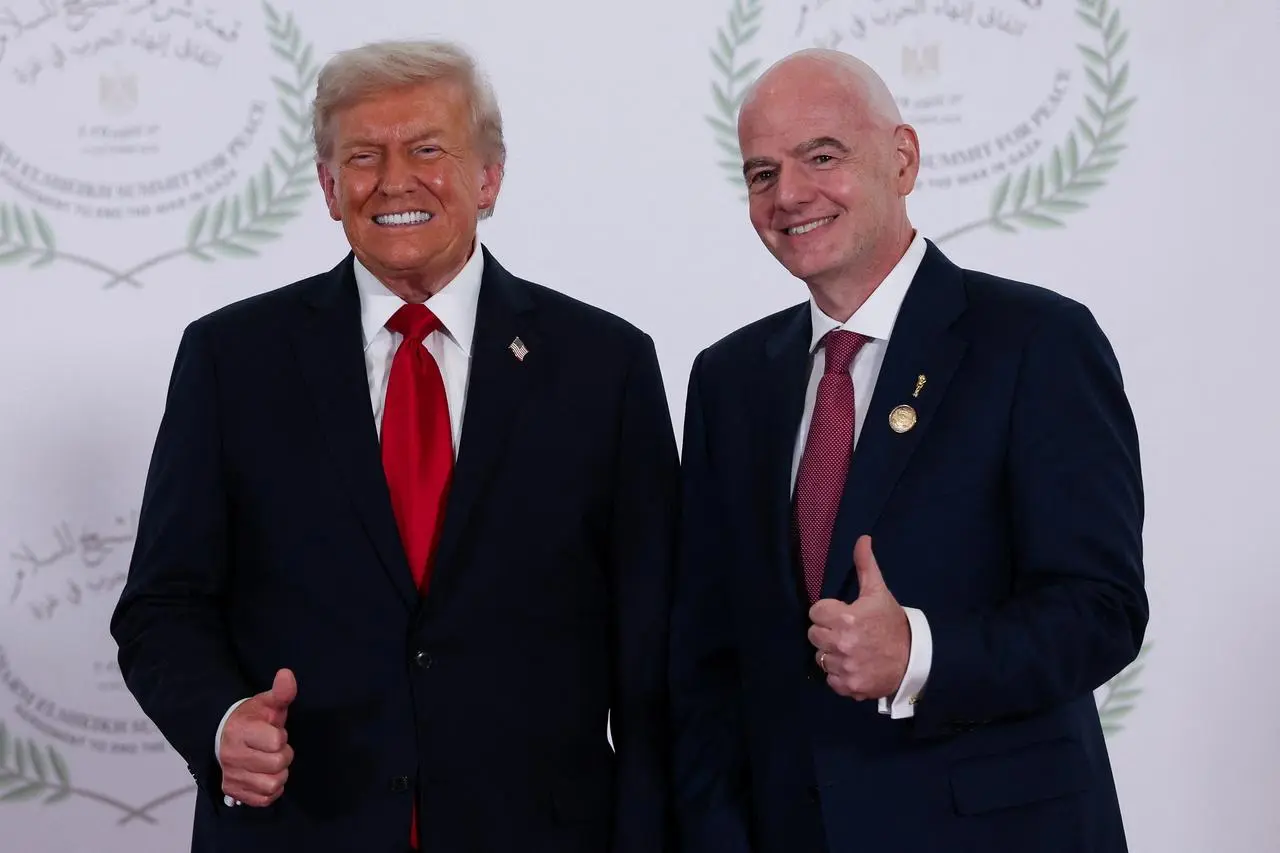 FIFA president Gianni Infantino, right, pictured with US president Donald Trump at the Sharm El Sheikh Peace Summit