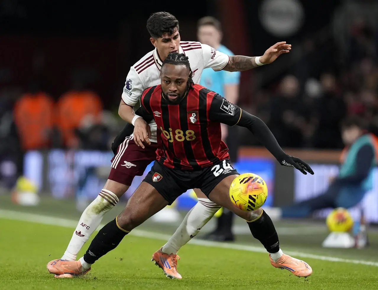 Antoine Semenyo (right) and Arsenal’s Piero Hincapie battle for the ball