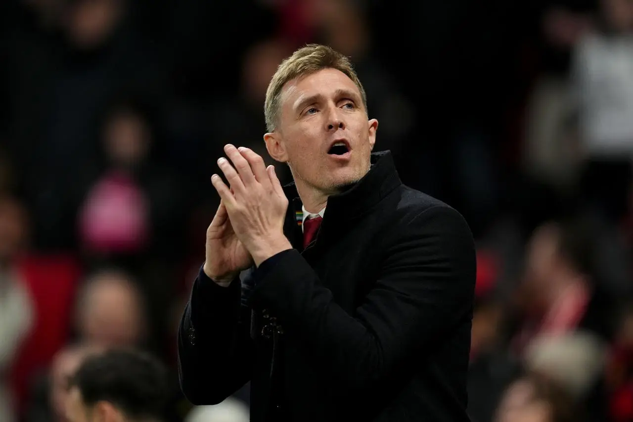 Manchester United interim manager Darren Fletcher gestures to the crowd