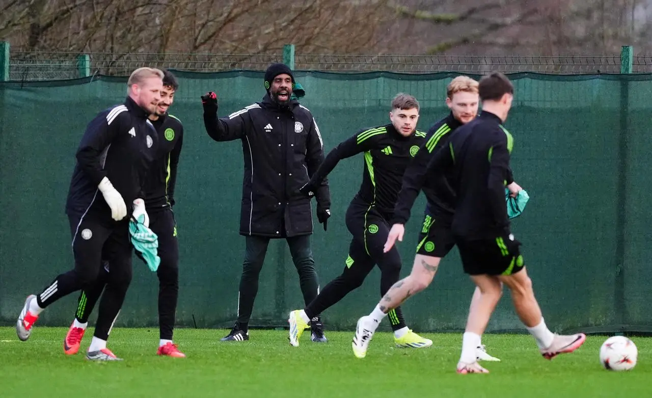 Celtic manager Wilfried Nancy, rear centre, shouts instructions to his team during a training session at the Lennoxtown training complex
