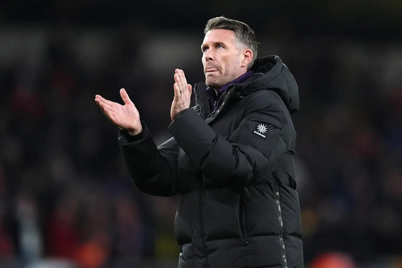 Wolves manager Rob Edwards applauds supporters