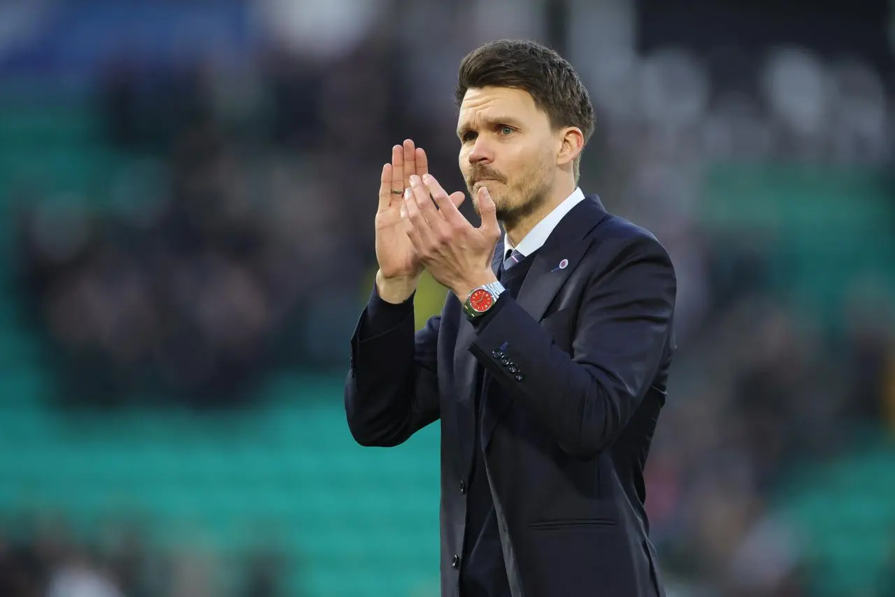 Danny Rohl claps the fans