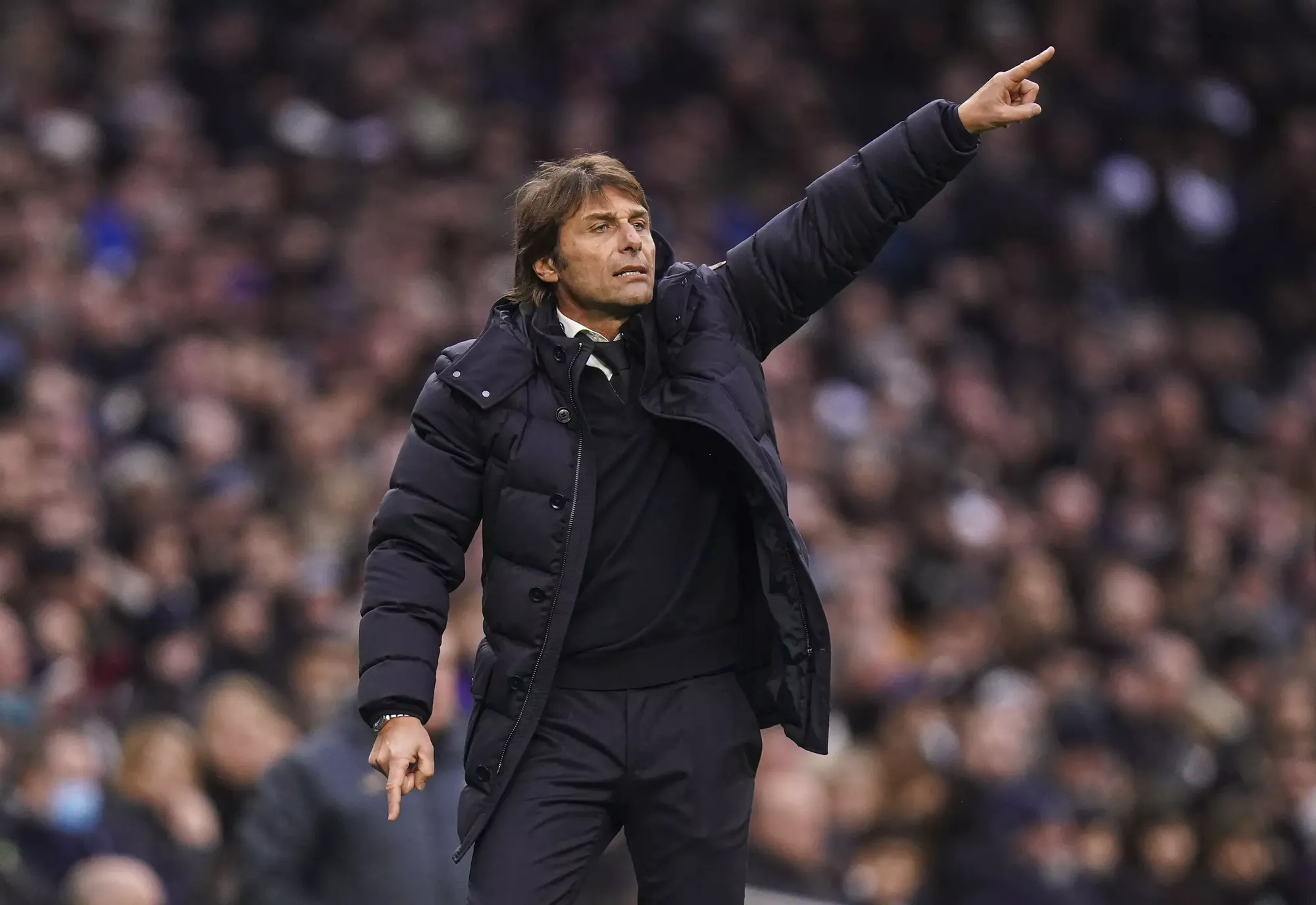 Tottenham manager Antonio Conte points out instructions to his players