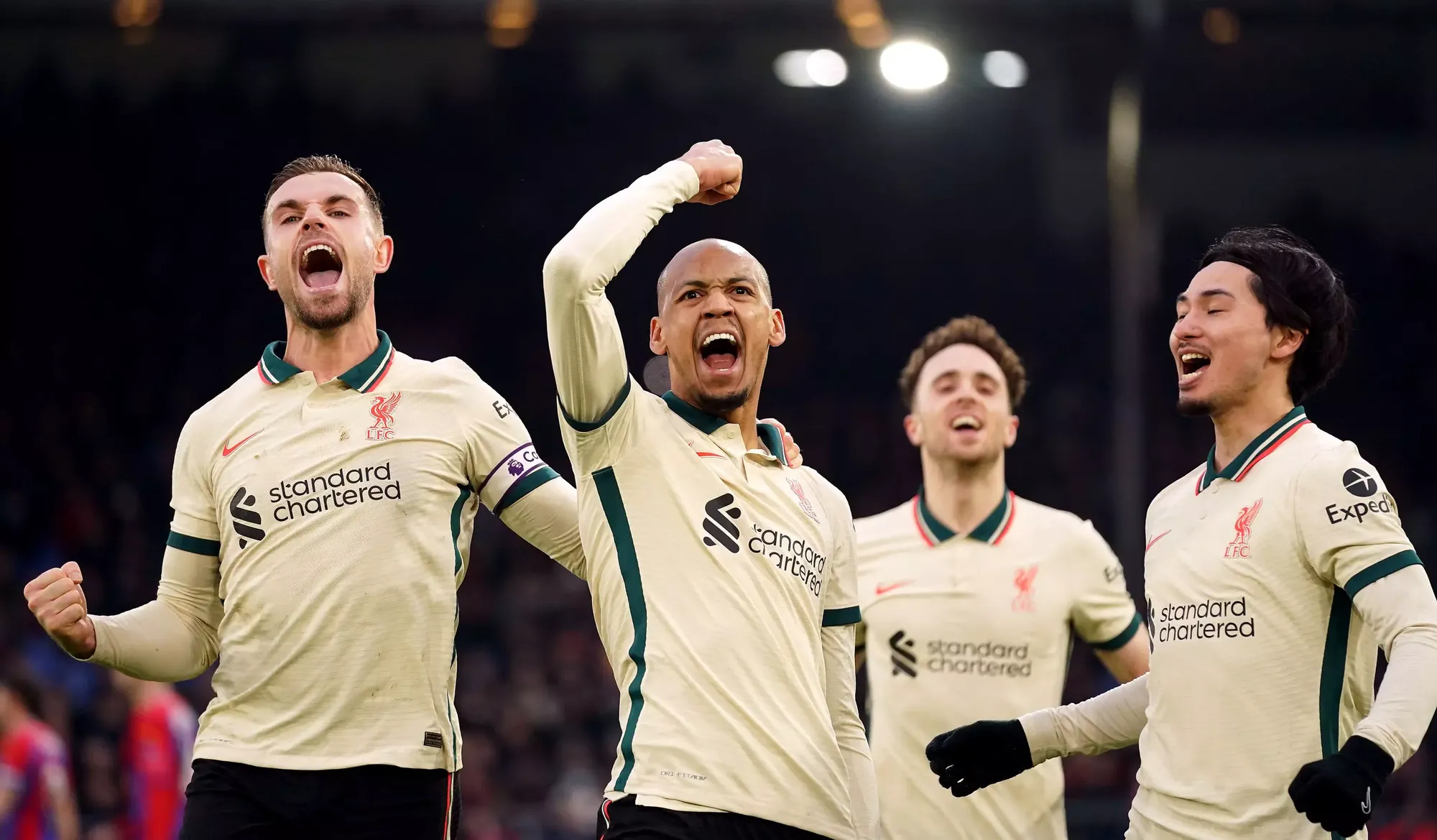 Fabinho celebrates with Jordan Henderson after making it 3-1 to Liverpool from the penalty spot