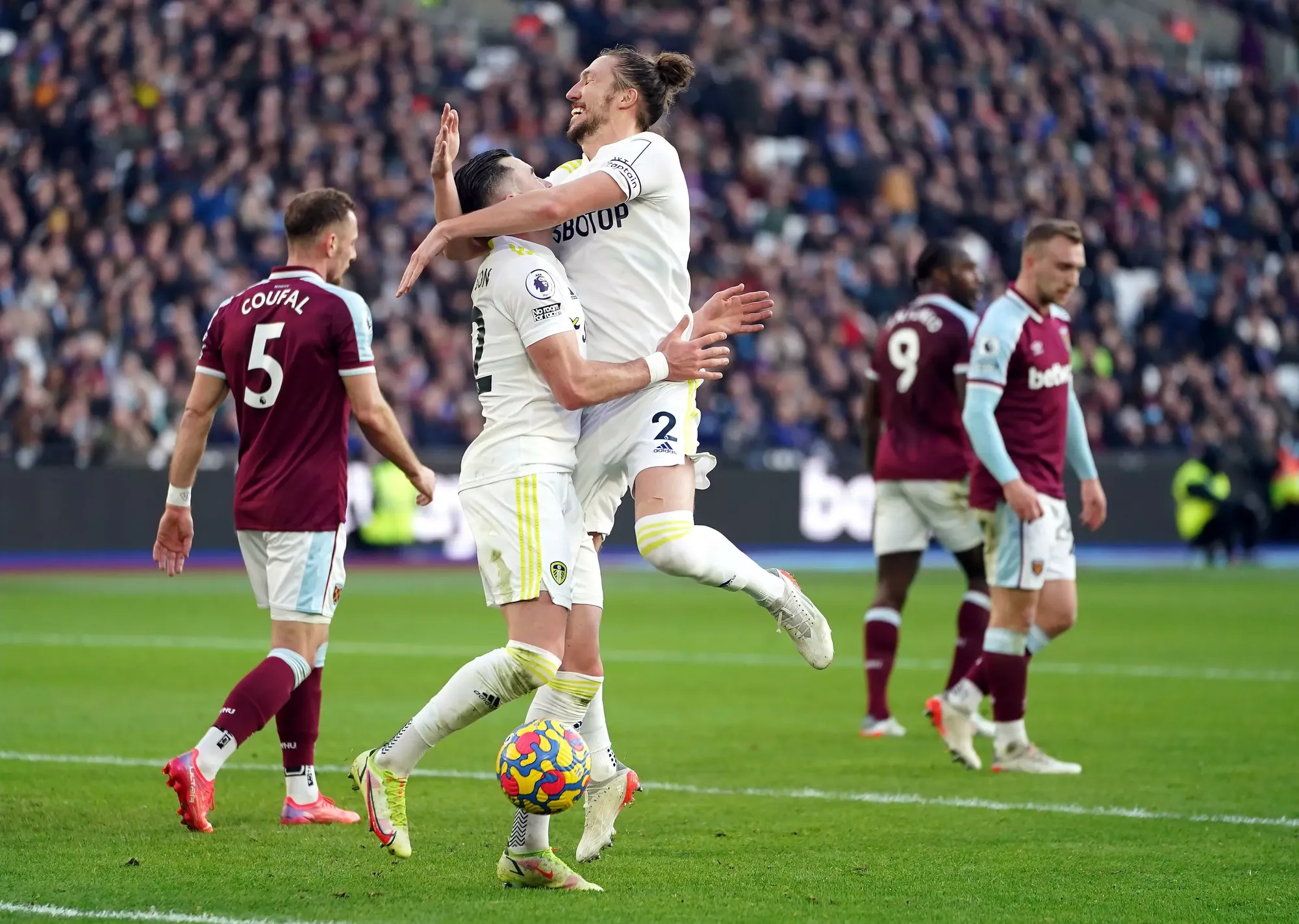 Jack Harrison celebrates with Luke Ayling