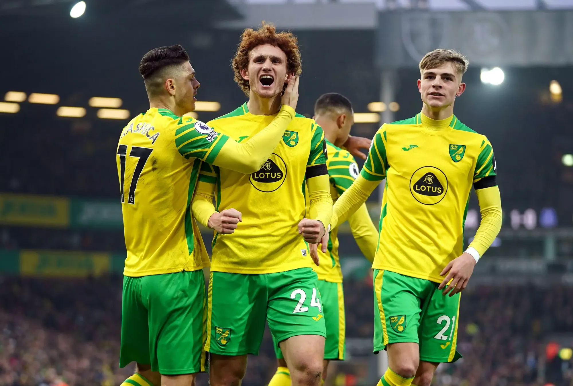 Josh Sargent, Milot Rashica and Brandon Williams celebrate Norwich's opening goal against Everton