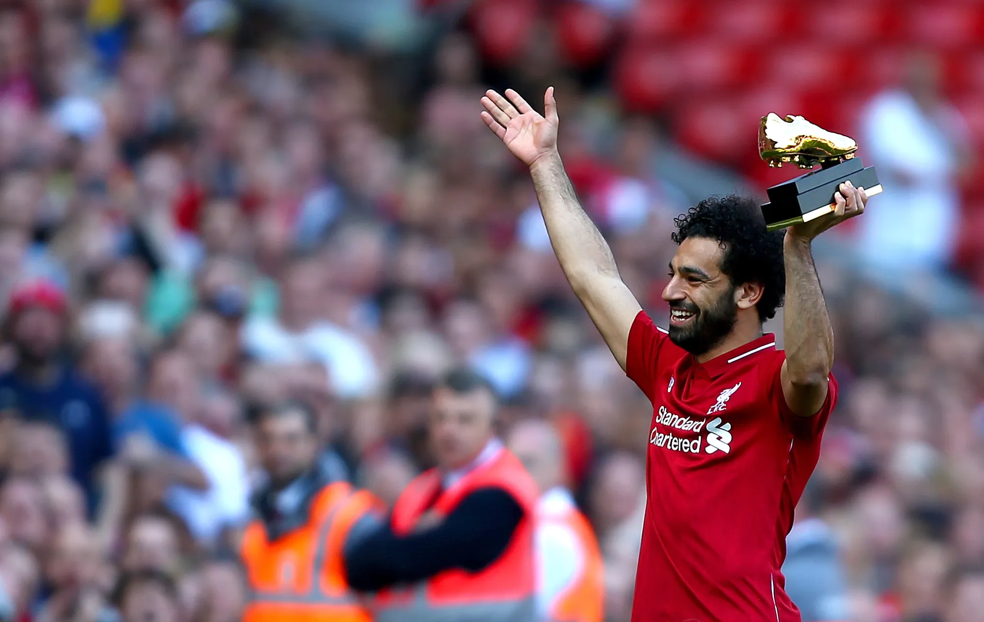 Mo Salah celebrates with is Golden Boot award