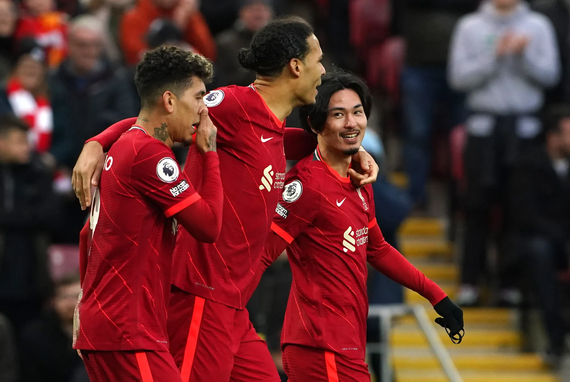 Roberto Firmino, Virgil van Dijk and Takumi Minamino celebrate