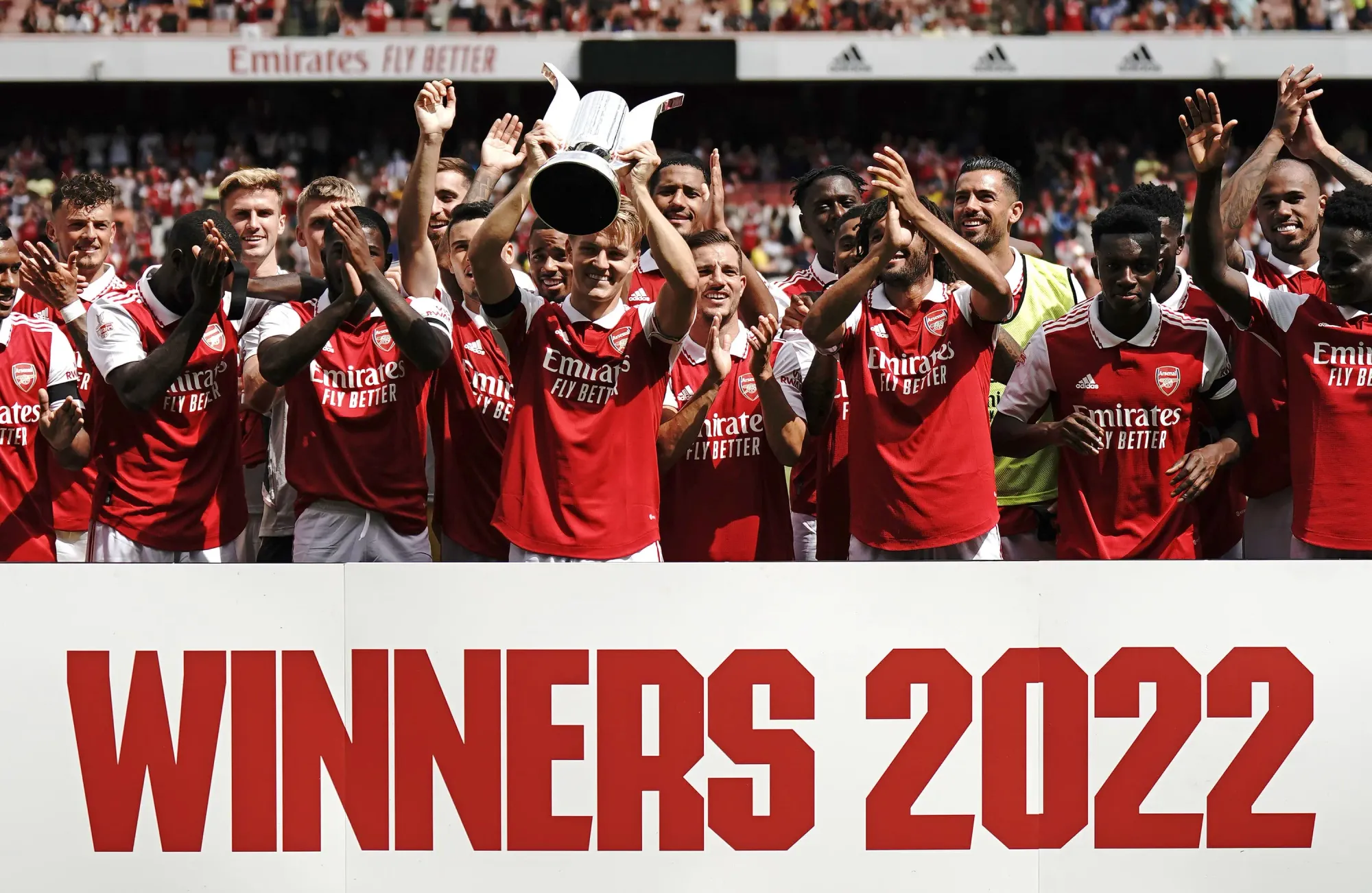 The Arsenal team celebrate lifting the Emirates Cup