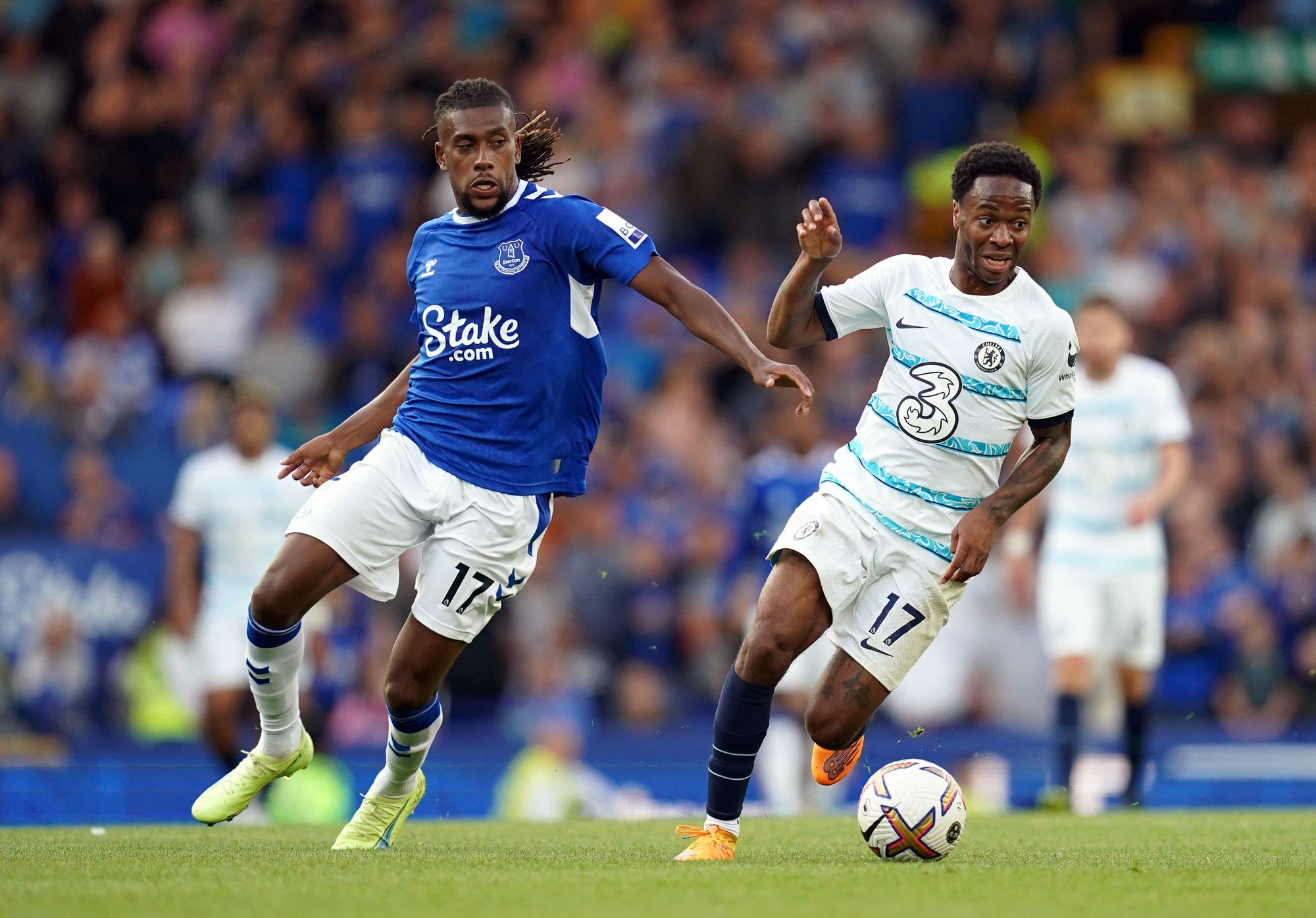 Raheem Sterling takes on Everton's Alex Iwobi in his Chelsea debut