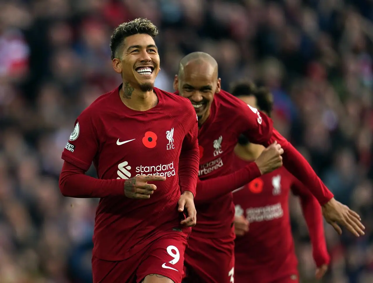 Roberto Firmino (left) celebrates for Liverpool