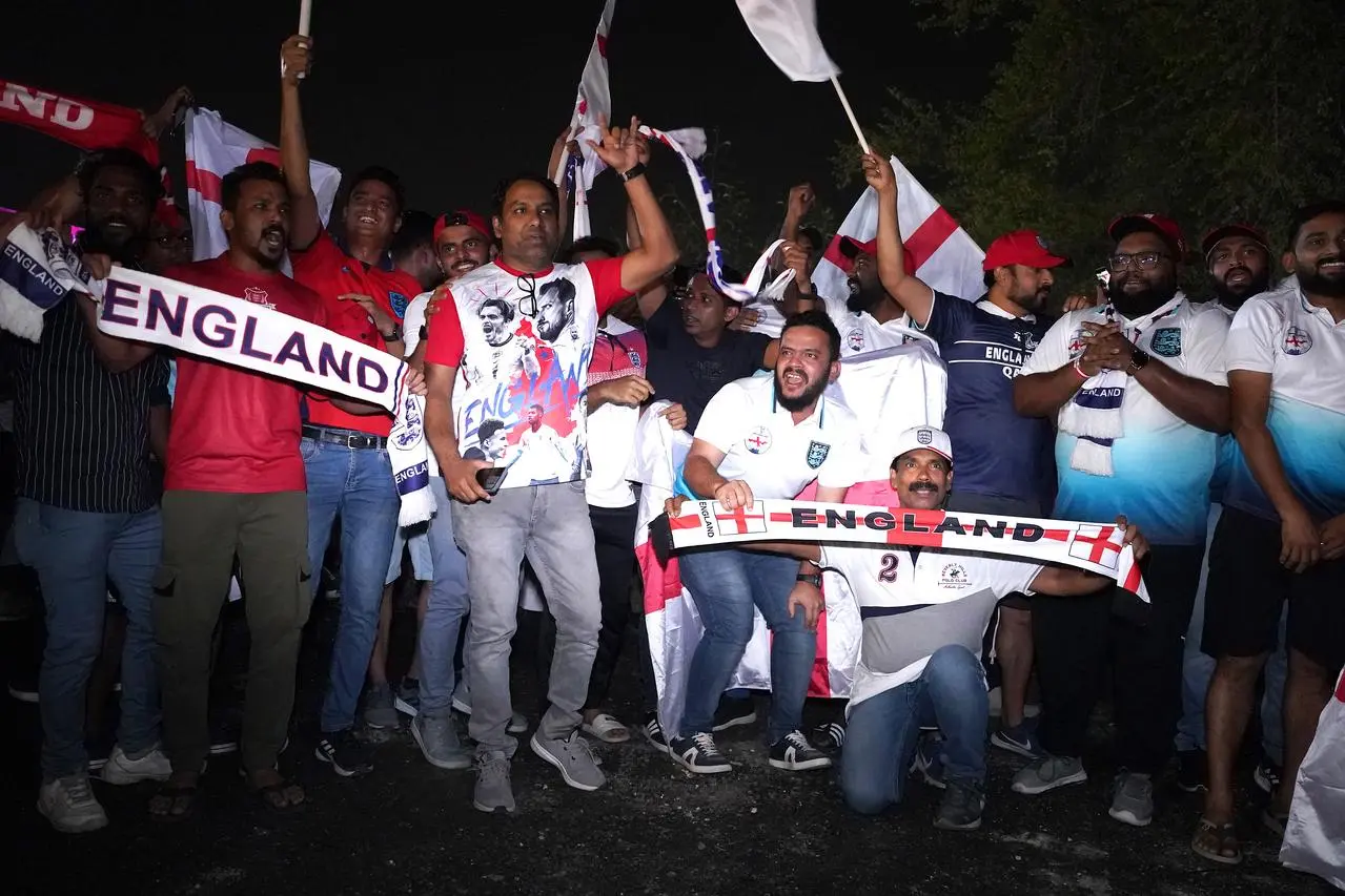 Fans greet the England team