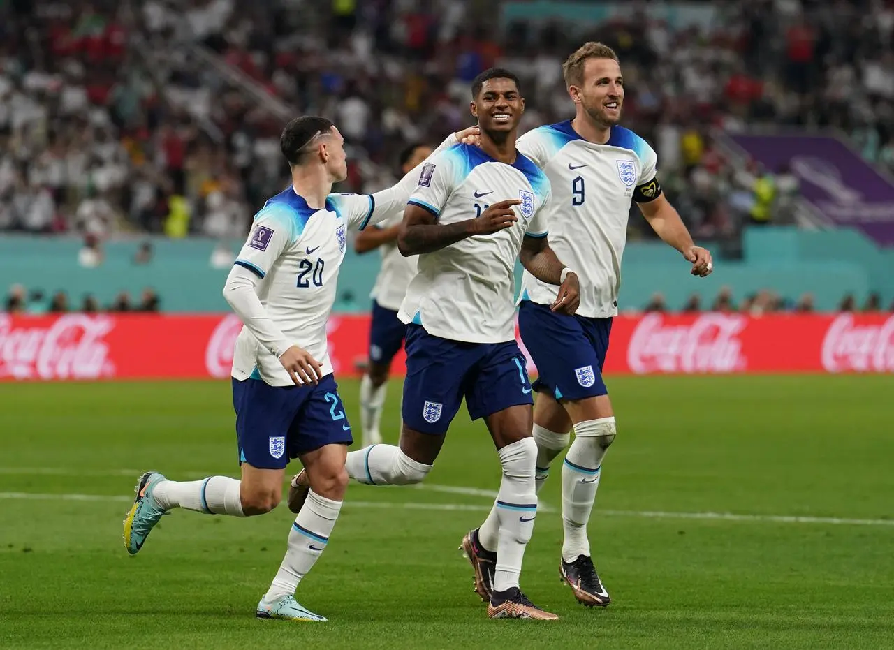 Marcus Rashford celebrates his goal against Iran