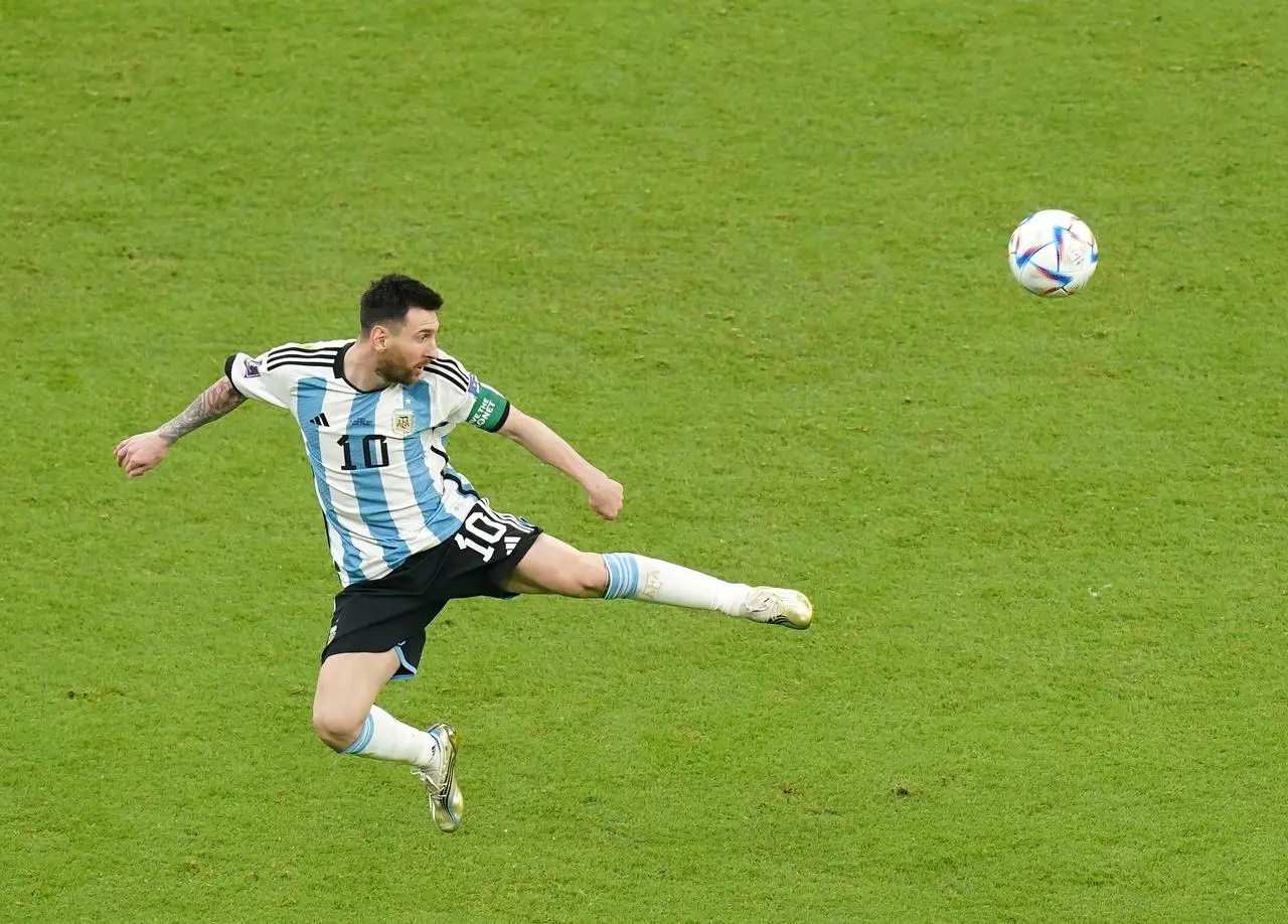 Lionel Messi controls the ball in the air