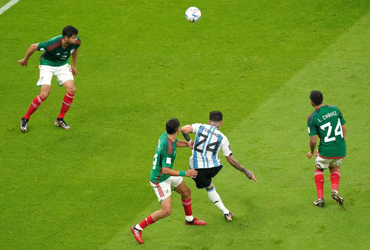 Enzo Fernandez, centre, scores Argentina’s second goal