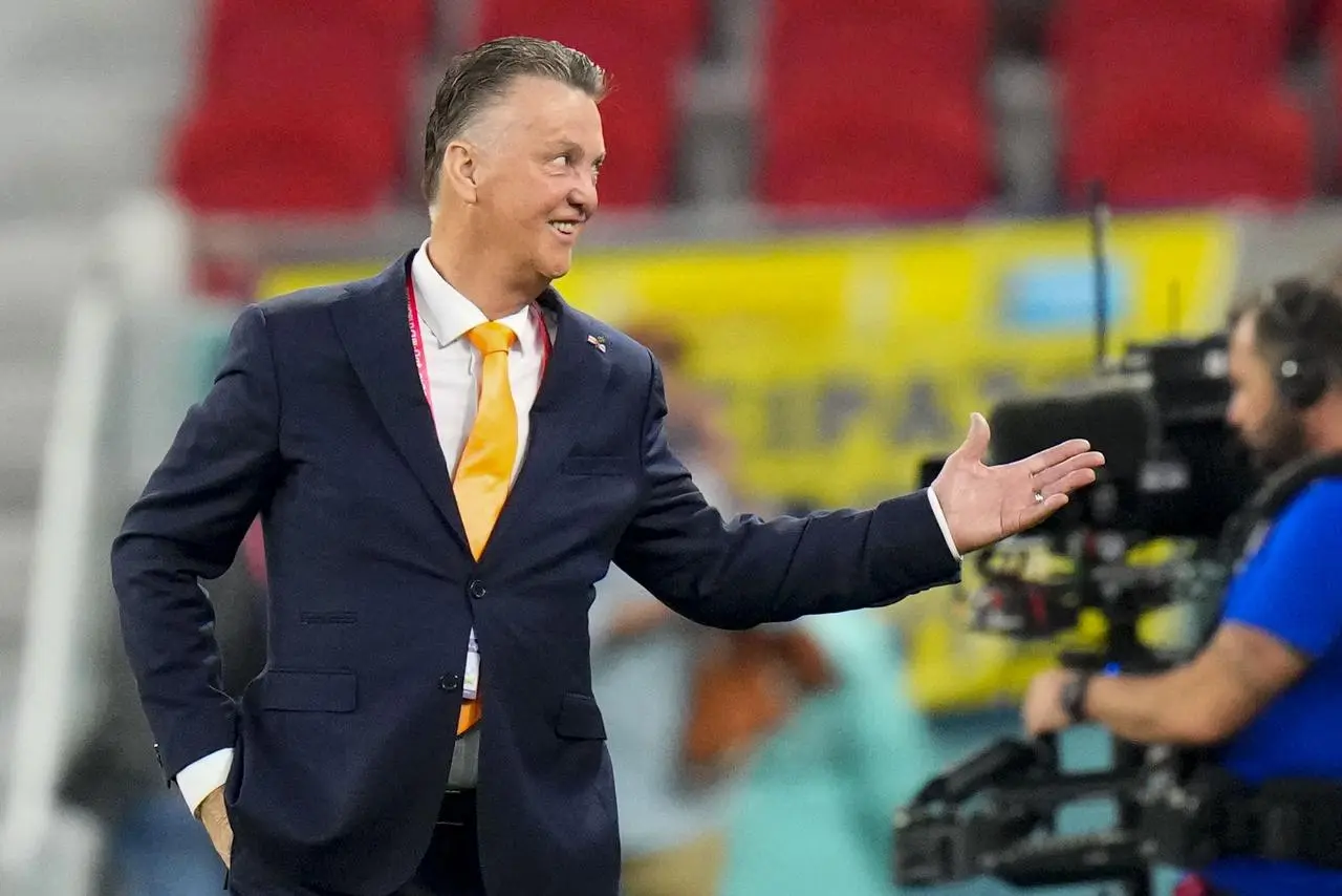 Louis van Gaal smiles prior to the start of the match 