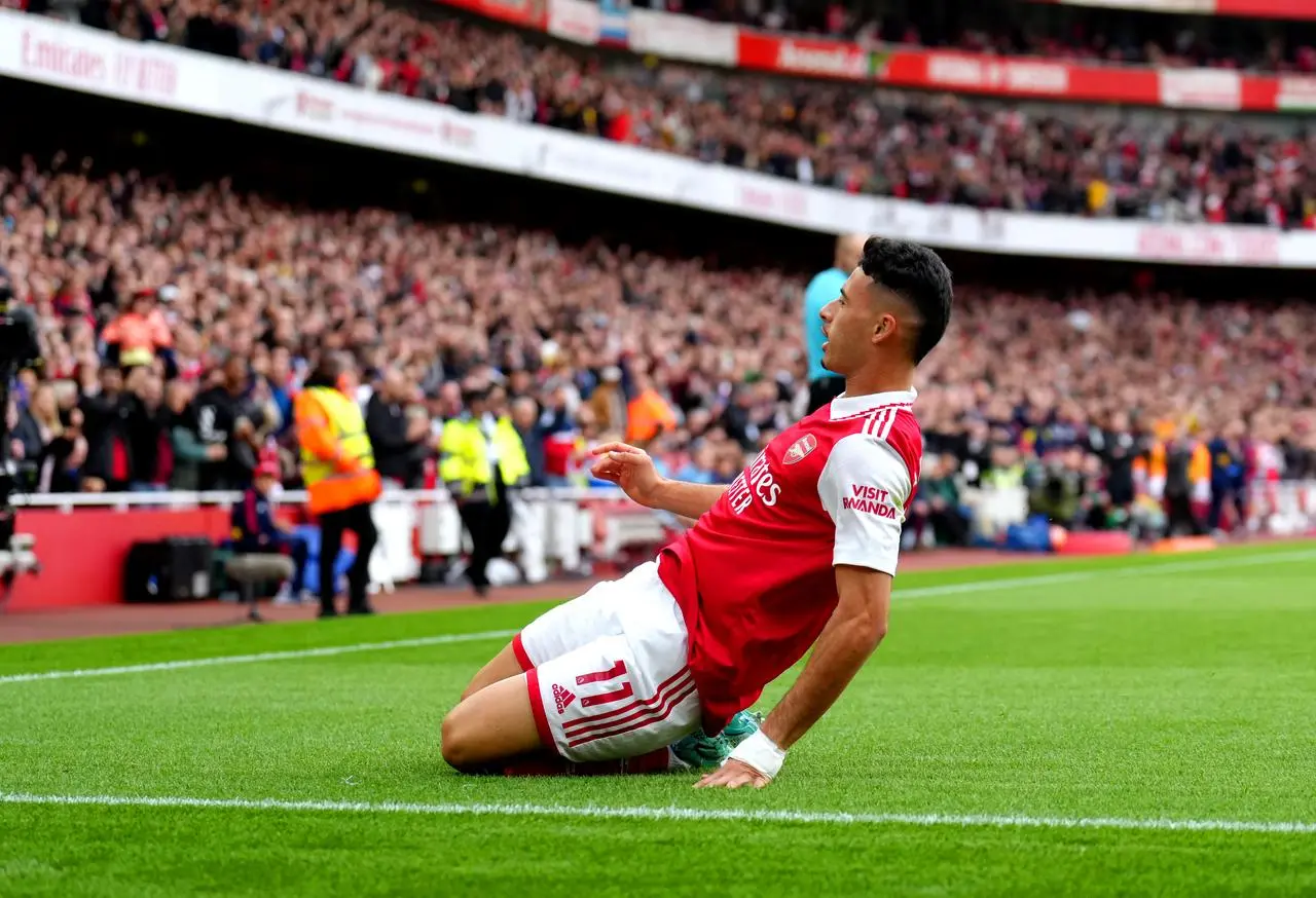 Arsenal’s Gabriel Martinelli slides on his knees