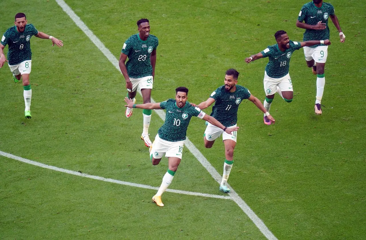 Saudi Arabia players celebrate scoring against Argentina