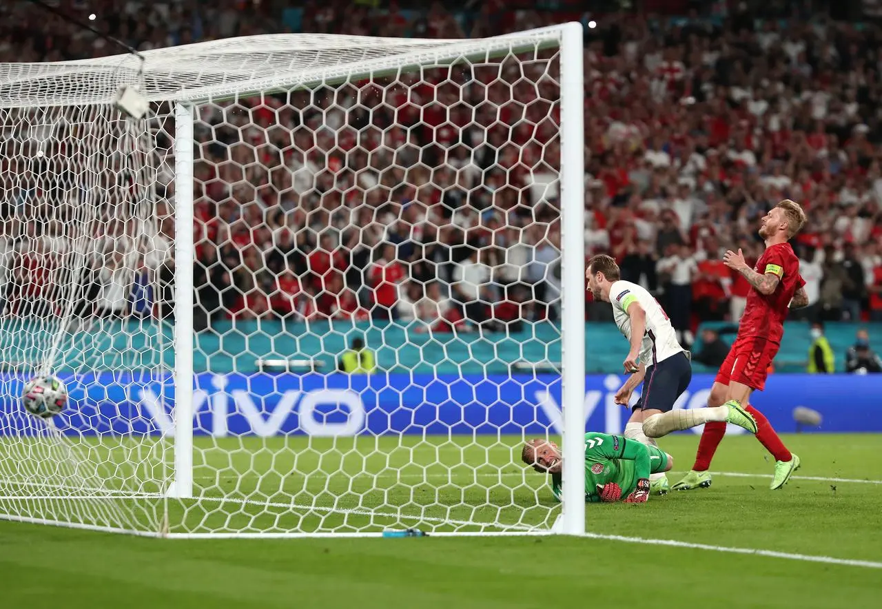 Harry Kane, second right, scores against Denmark in the Euro 2020 semi-final