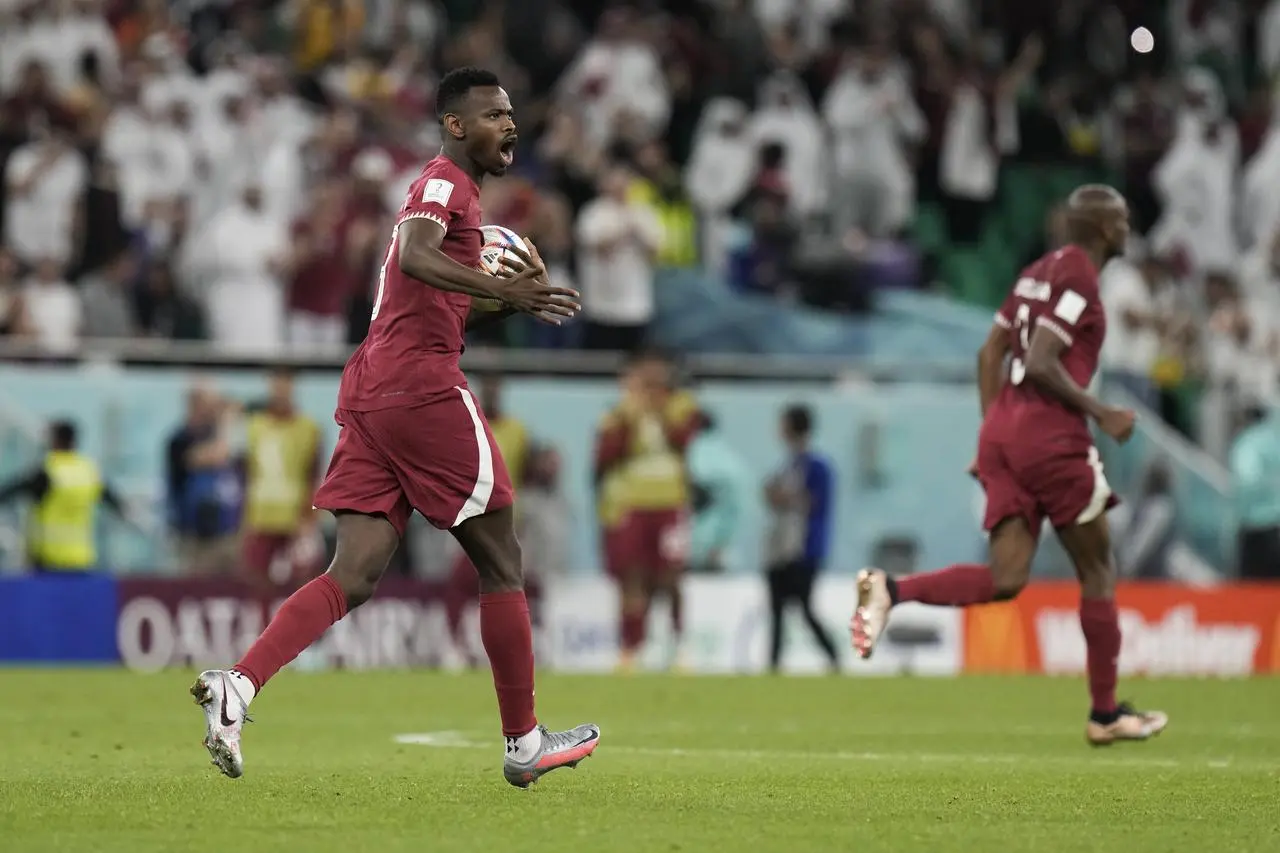 Mohammed Muntari celebrates after his second-half header gave Qatar hope of a fightback