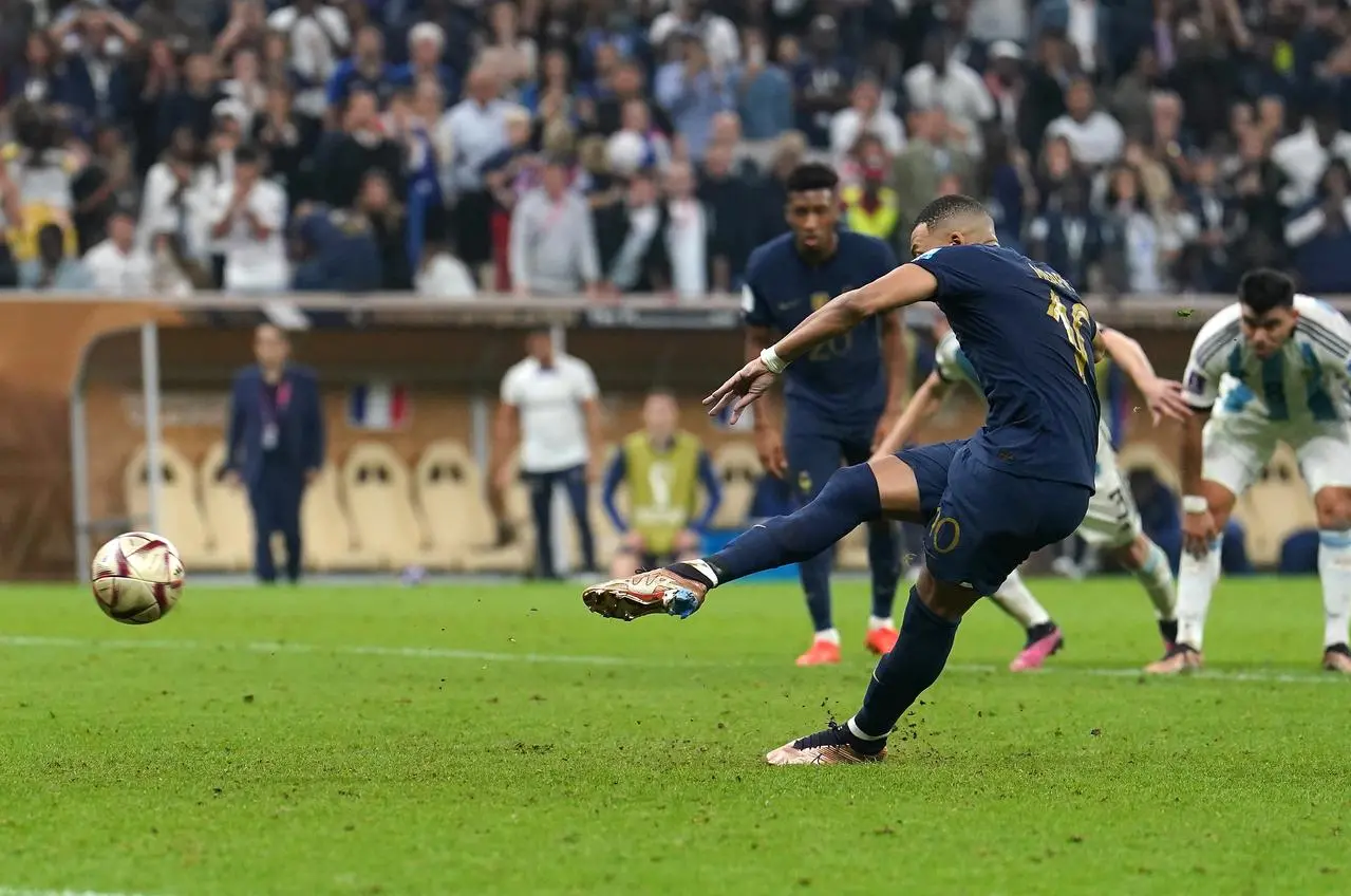 Kylian Mbappe scores his and France's third goal in the final