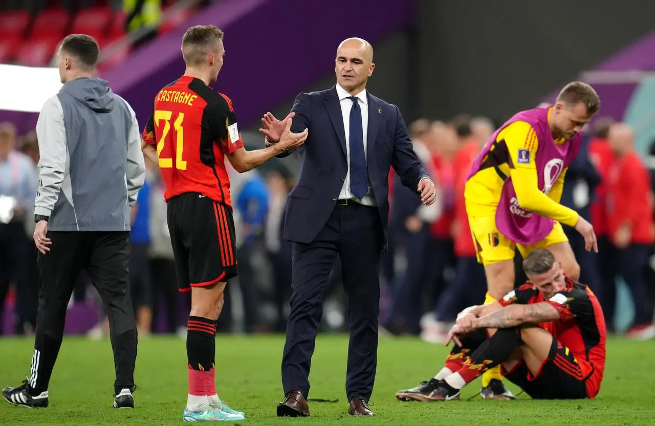 Roberto Martinez consoles Timothy Castagne