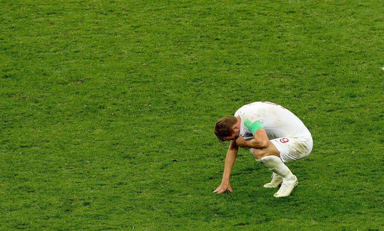 A dejected Harry Kane after the final whistle signals World Cup semi-final defeat by Croatia