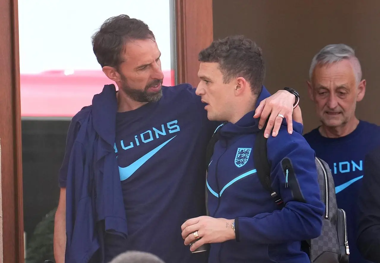 England manager Gareth Southgate embraces Kieran Trippier outside the Souq Al-Wakra hotel 