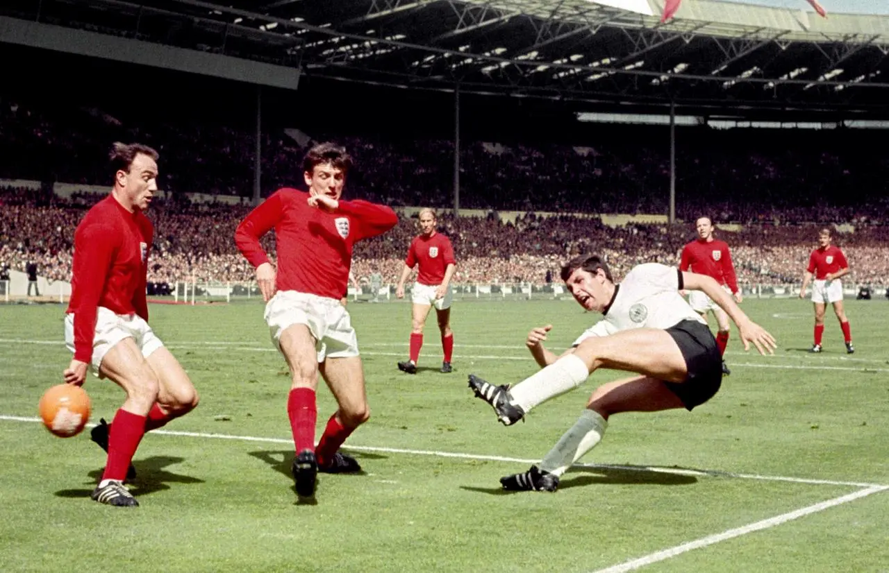 George Cohen, left, in action in the 1966 World Cup final