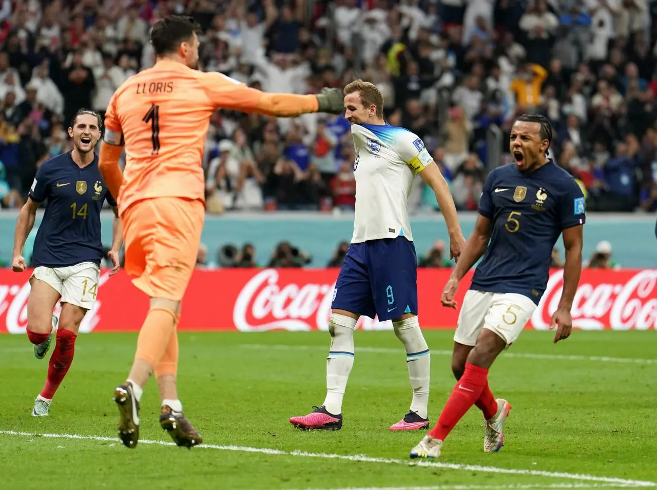 Harry Kane, centre, reacts to his penalty miss