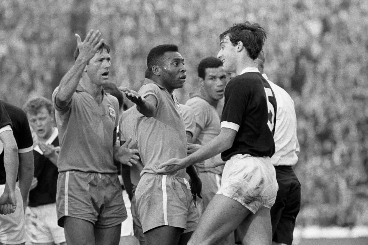 The Brazilian remonstrates with Scotland's Ronnie McKinnon, right, following a clash with Billy Bremner, back left. The incident took place during an international friendly at Hampden Park, Glasgow in June 1966