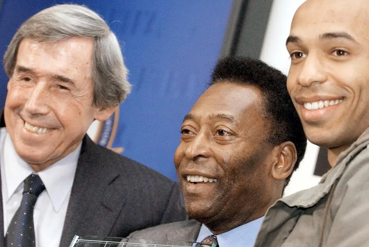 Pele, centre, joins former England goalkeeper Gordon Banks, left, and Arsenal striker Thierry Henry, right, in March 2004 to announce the 100 all-time greatest footballers. The list was chosen for the celebration of 100 years of world governing body FIFA