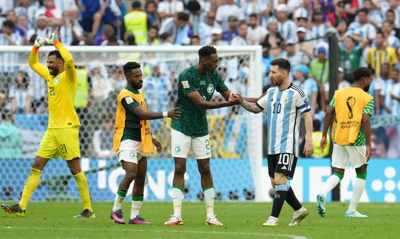 Lionel Messi, right, congratulates Saudi Arabia’s Mohamed Kanno after the World Cup Group C match at Lusail Stadium