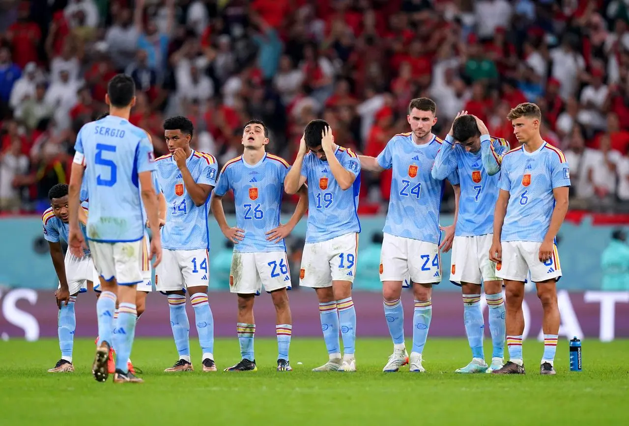 Spain look dejected after losing to Morocco in the World Cup round of 16