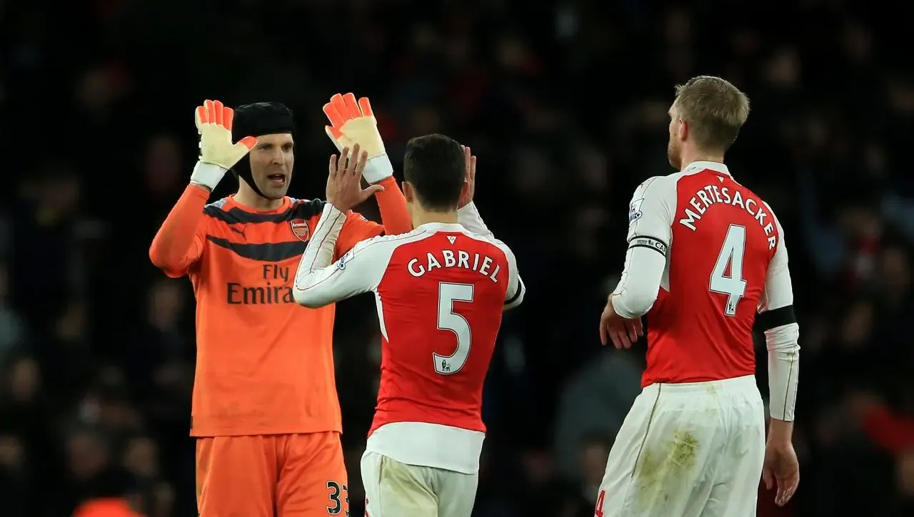 Arsenal goalkeeper Petr Cech with Gabriel and Per Mertesacker 
