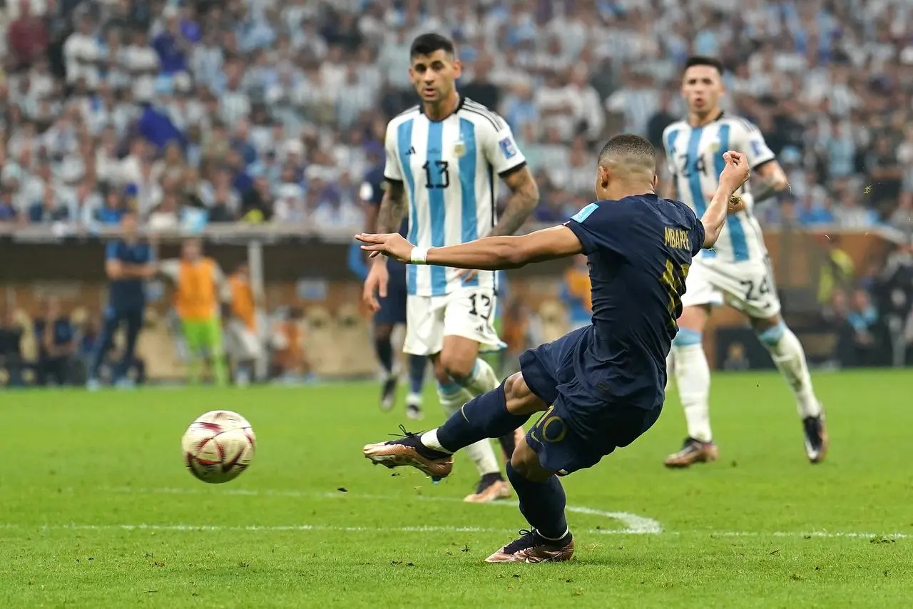 France’s Kylian Mbappe scores