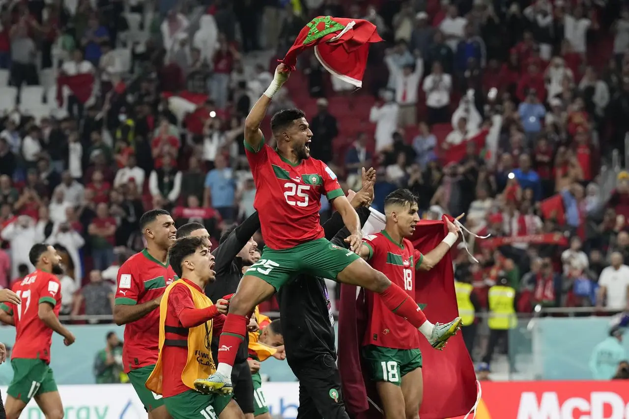 Morocco's Yahia Attiyat Allah leaps in celebration