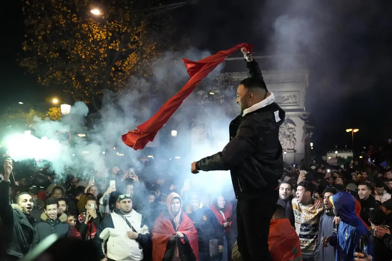 Morocco fans in Paris celebrate their team's victory