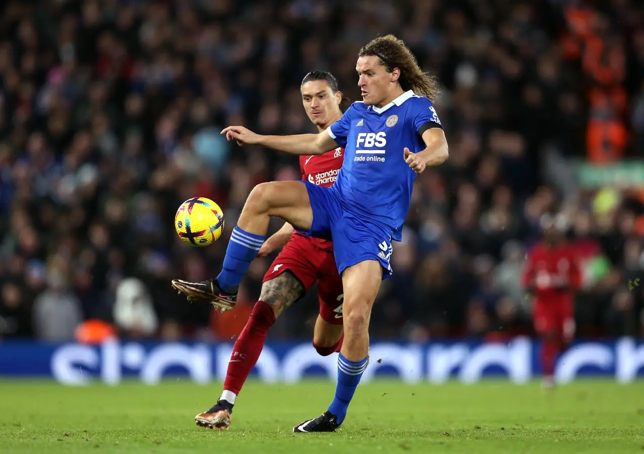 Wout Faes, right, plays the ball under pressure from Darwin Nunez