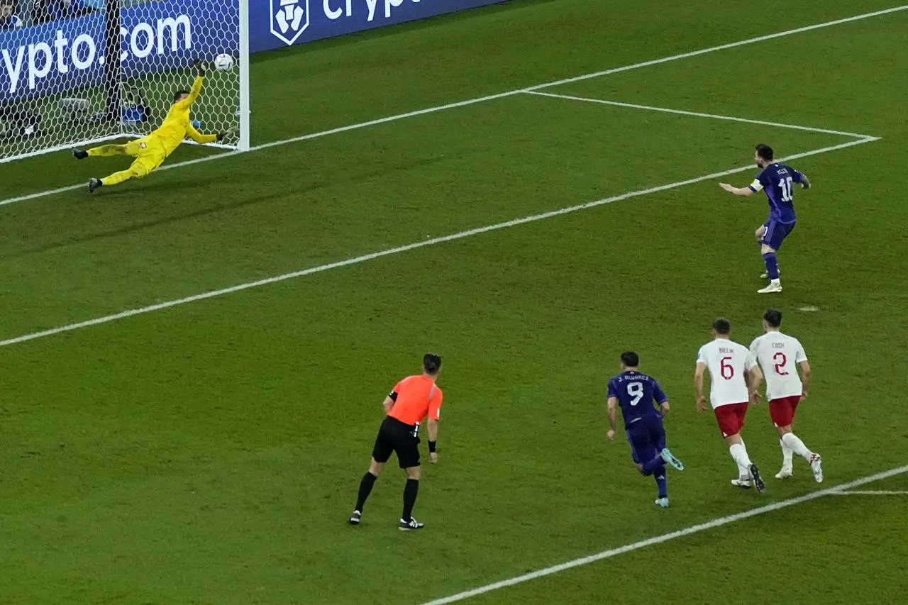 Wojciech Szczesny, left, saves Lionel Messi's penalty