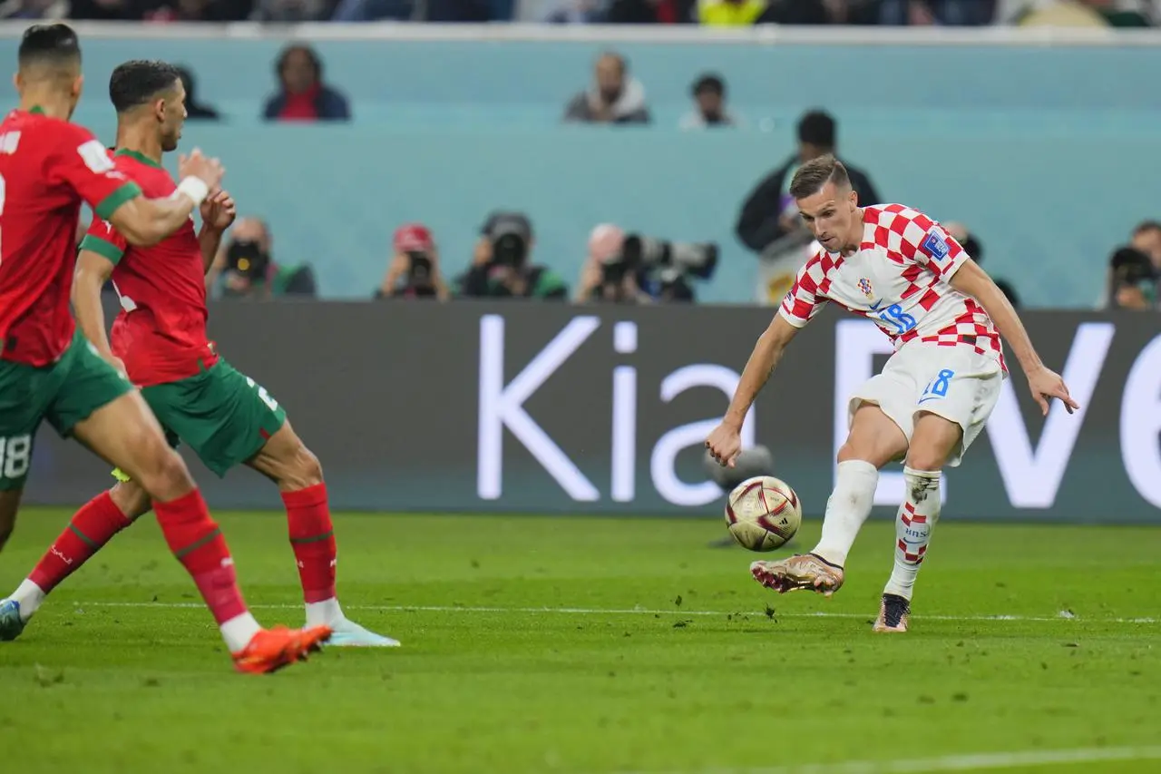 Mislav Orsic curls in the winner against Morocco (Hassan Ammar/AP).