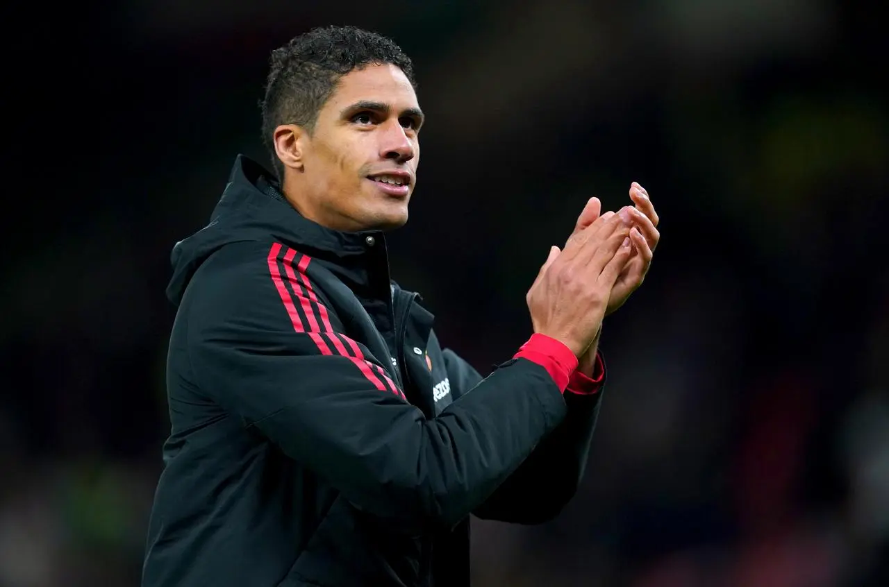 Manchester United’s Raphael Varane applauds the fans