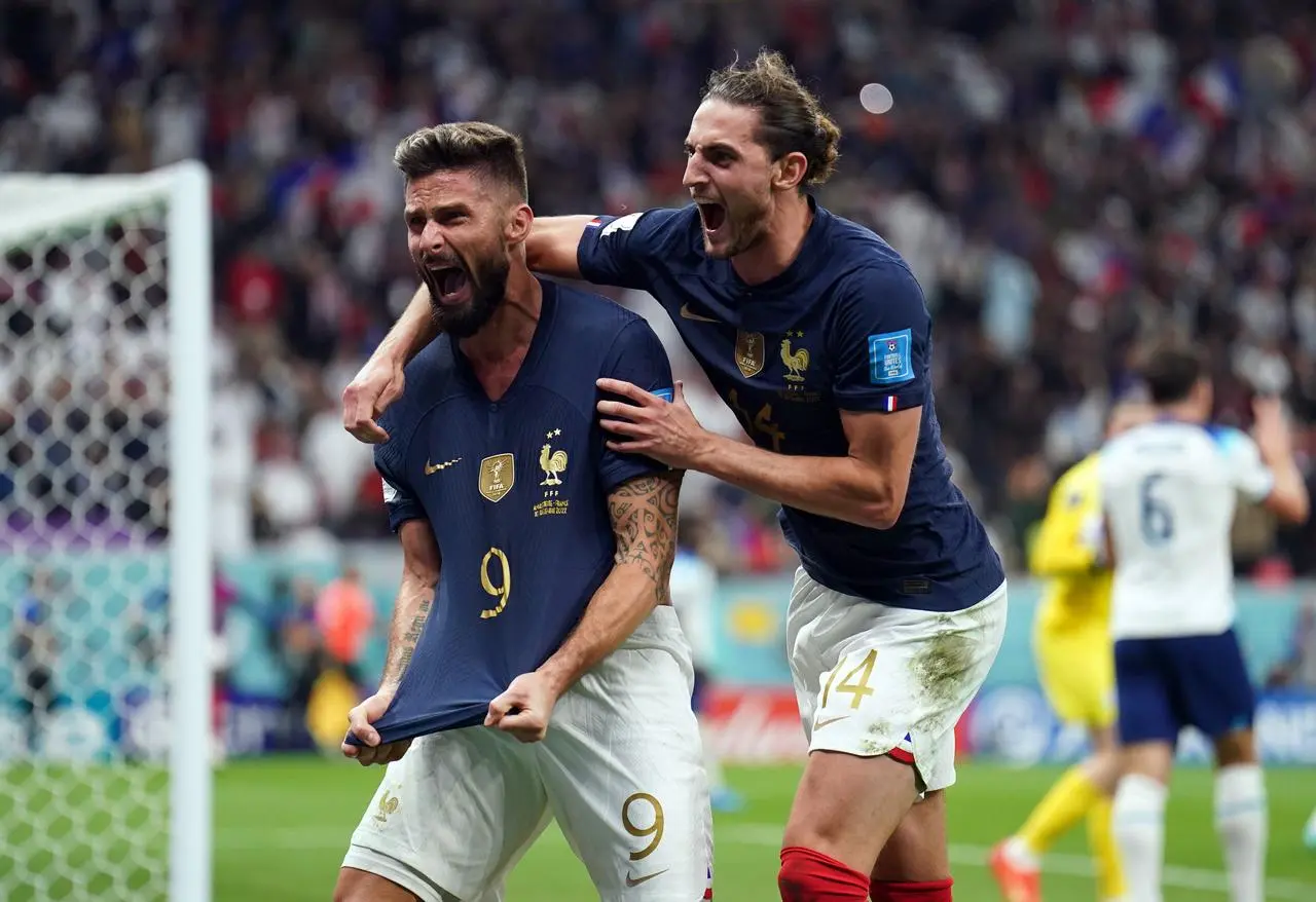 Olivier Giroud celebrates scoring his sides second goal with Adrien Rabiot, right 