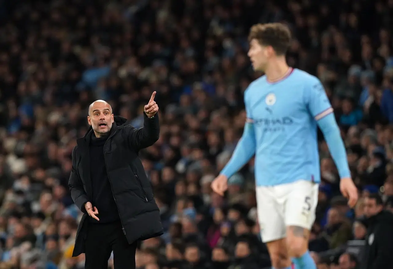 Pep Guardiola and John Stones