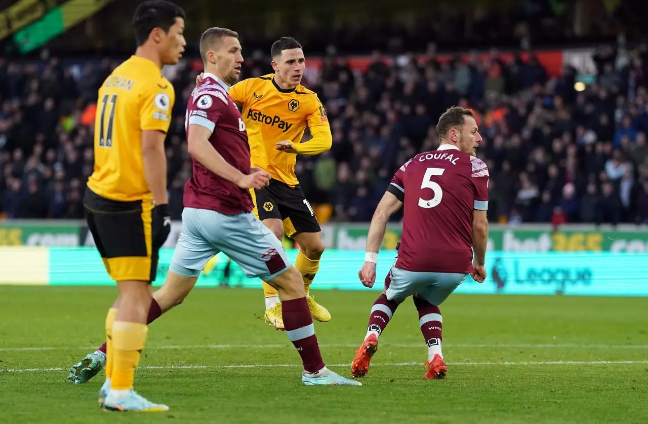 Daniel Podence, centre, scores Wolves' winner