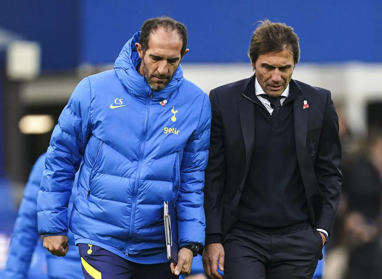 Cristian Stellini, left, filled in for Antonio Conte at a press conference