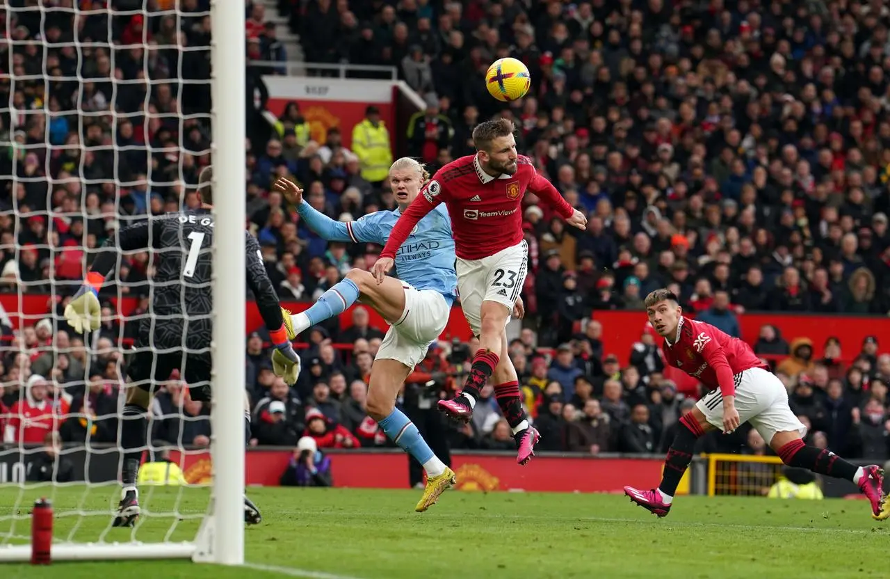 Luke Shaw clears as Erling Haaland threatens