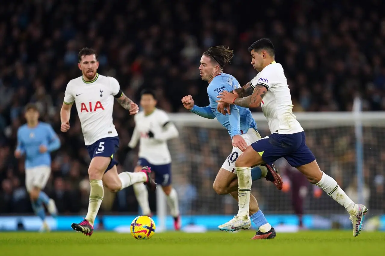 Jack Grealish contests for the ball against Tottenham