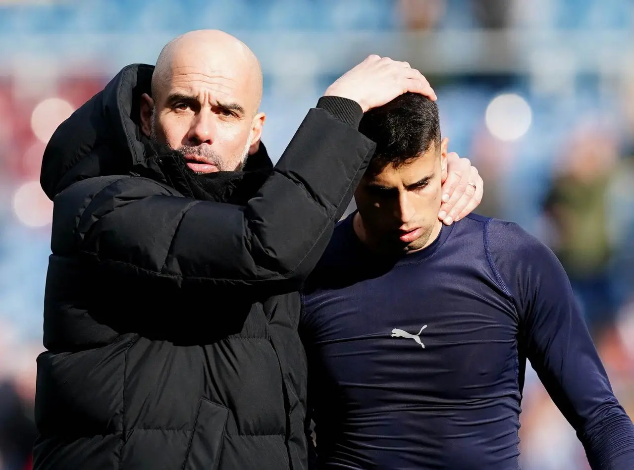 Pep Guardiola and Joao Cancelo